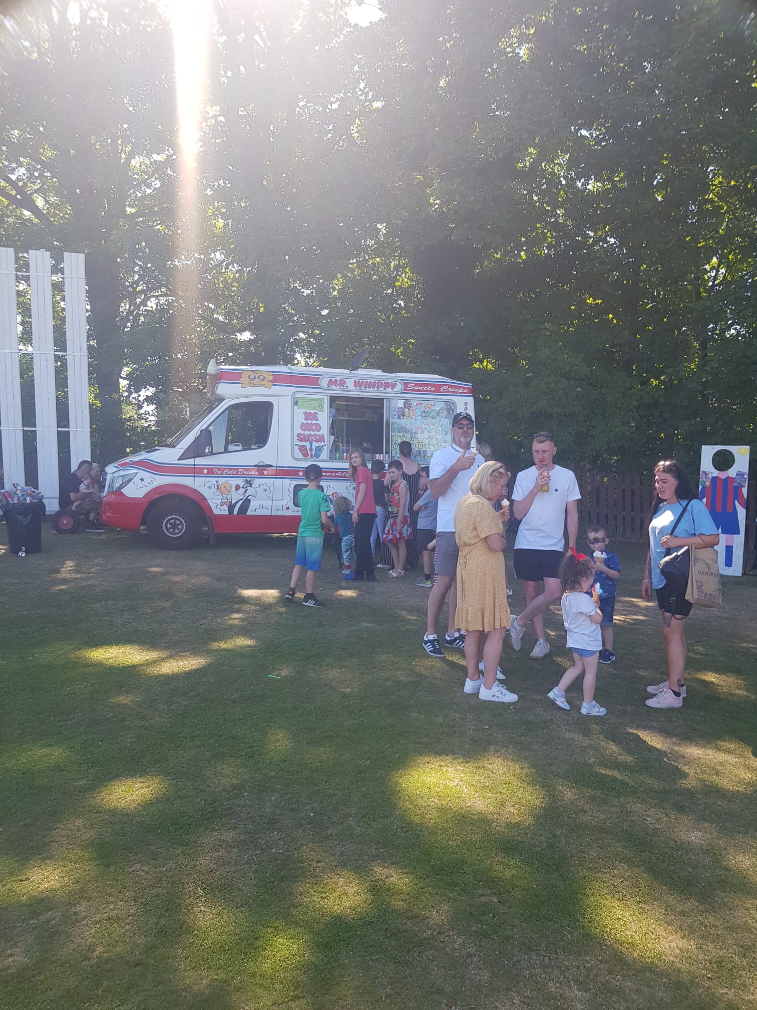 Mr Whippy van at a sunny park event